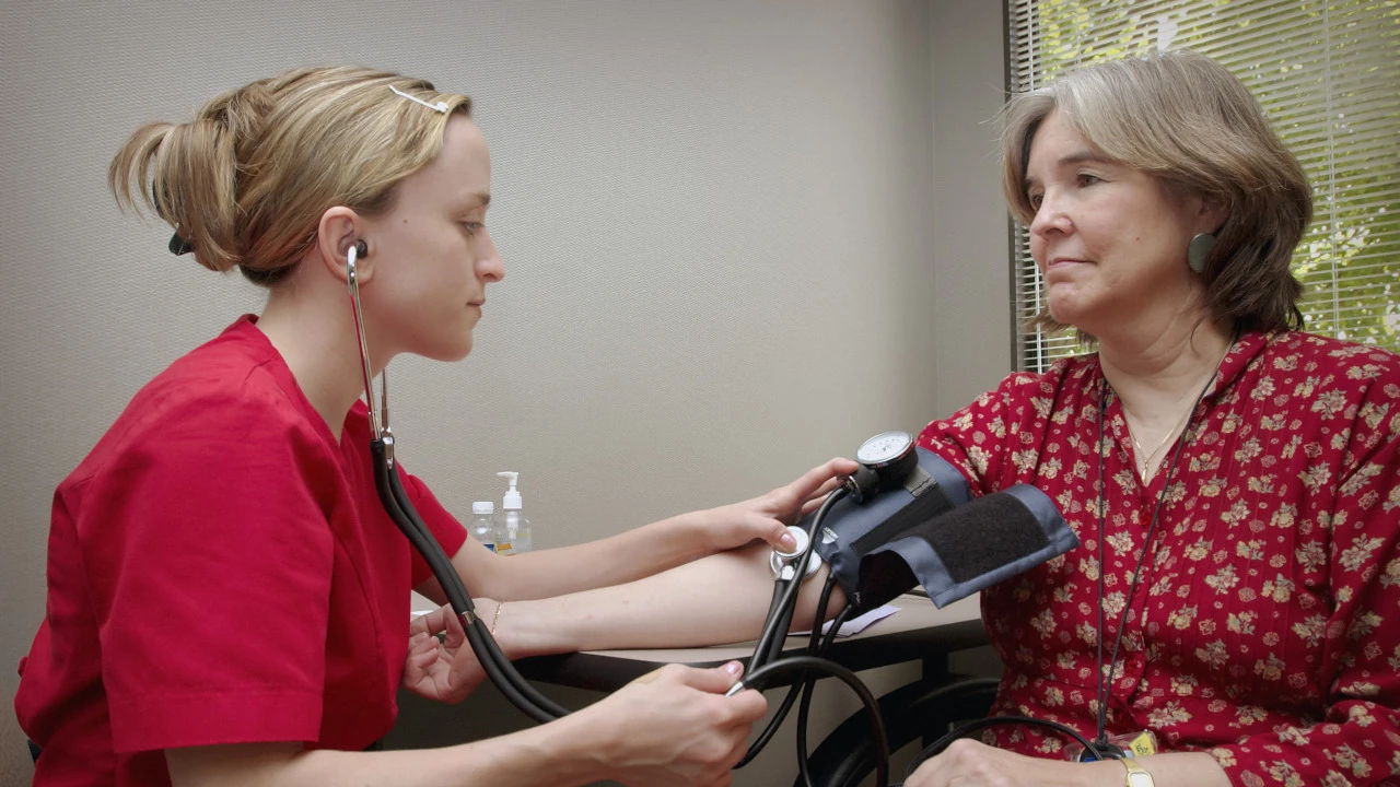 A nurse measuring a patient's blood pressure.